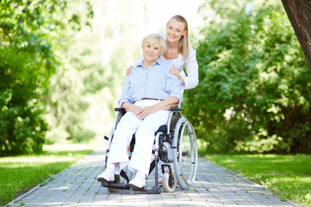 Caregiver-with-Elderly-Woman-in-Wheelchair