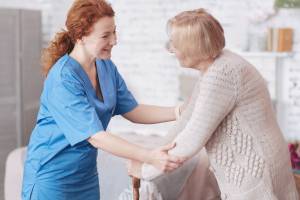 Caregiver-Helping-Elderly-Woman