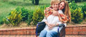 Daughter helping senior mother