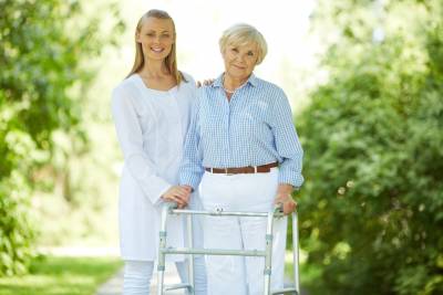 Young-Caregiver-with-Elderly-Woman
