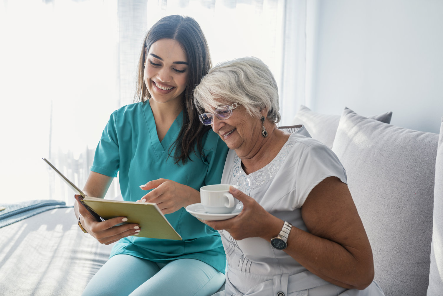 Caregiver-Senior-Reading-Drinking-Coffee