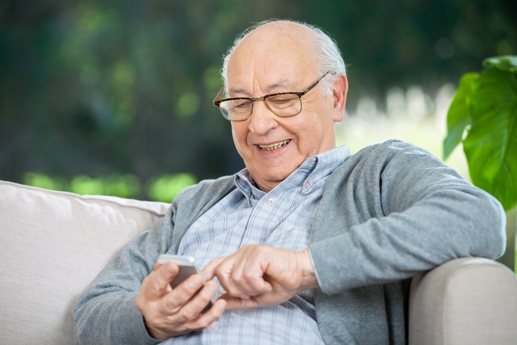 Elderly-Man-Using-Phone-Happy