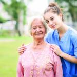 nurse caregiver with Asian elderly woman