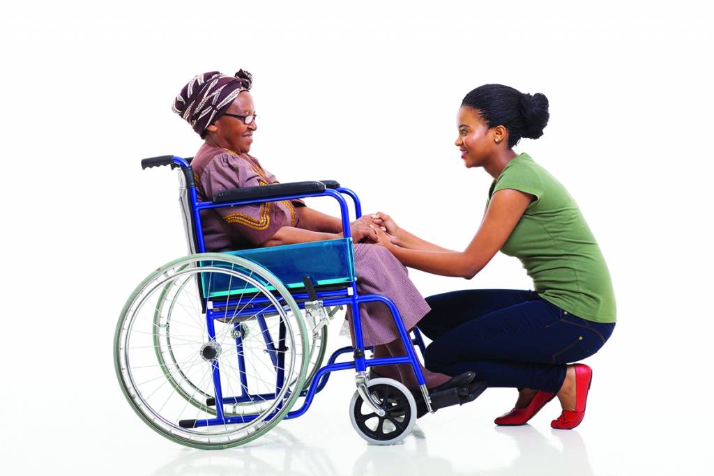 Caregiver with Senior in Wheelchair