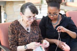 Family enjoying time together, knitting