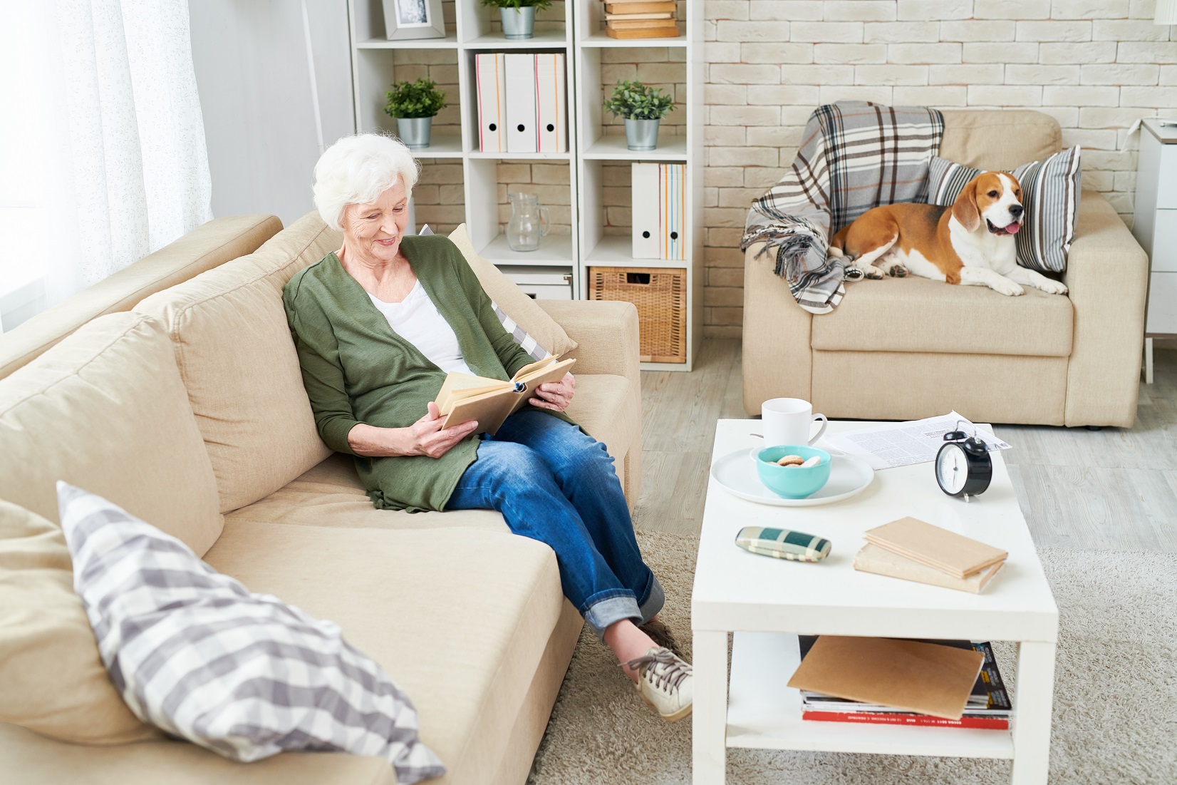 Elderly reading with a pet