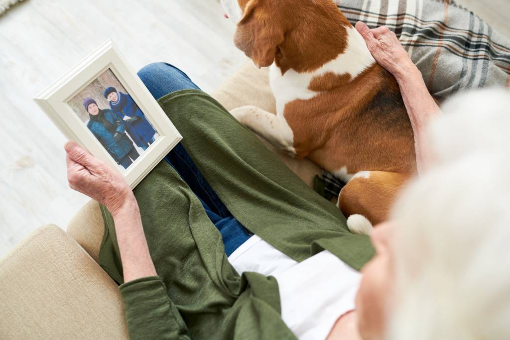  Senior Woman Petting a Dog