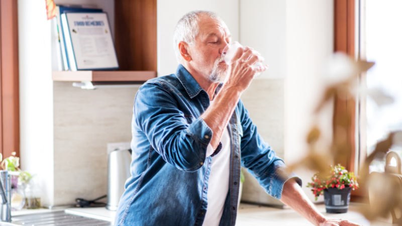 Senior man drinking water