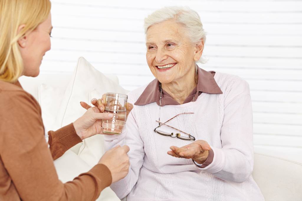 Senior citizen woman drinking water