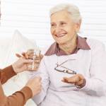 Senior citizen woman drinking water