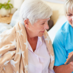 Senior discussing care plan with caregiver