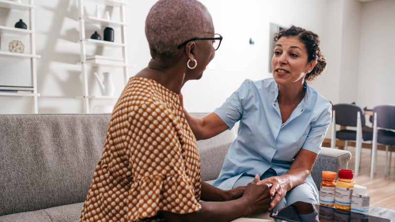 Senior discussing care plan with caregiver