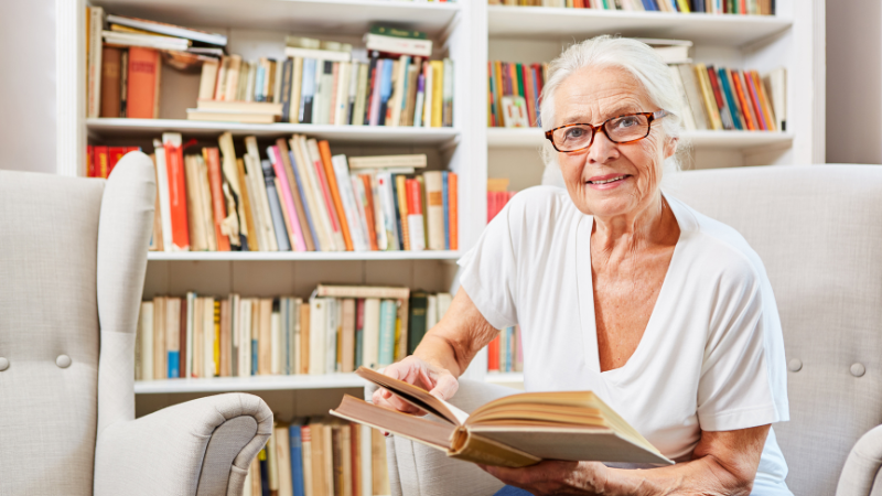 Senior reading a book at home