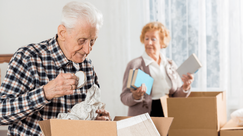 Seniors packing and decluttering