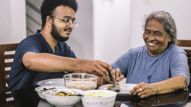 Senior sharing food